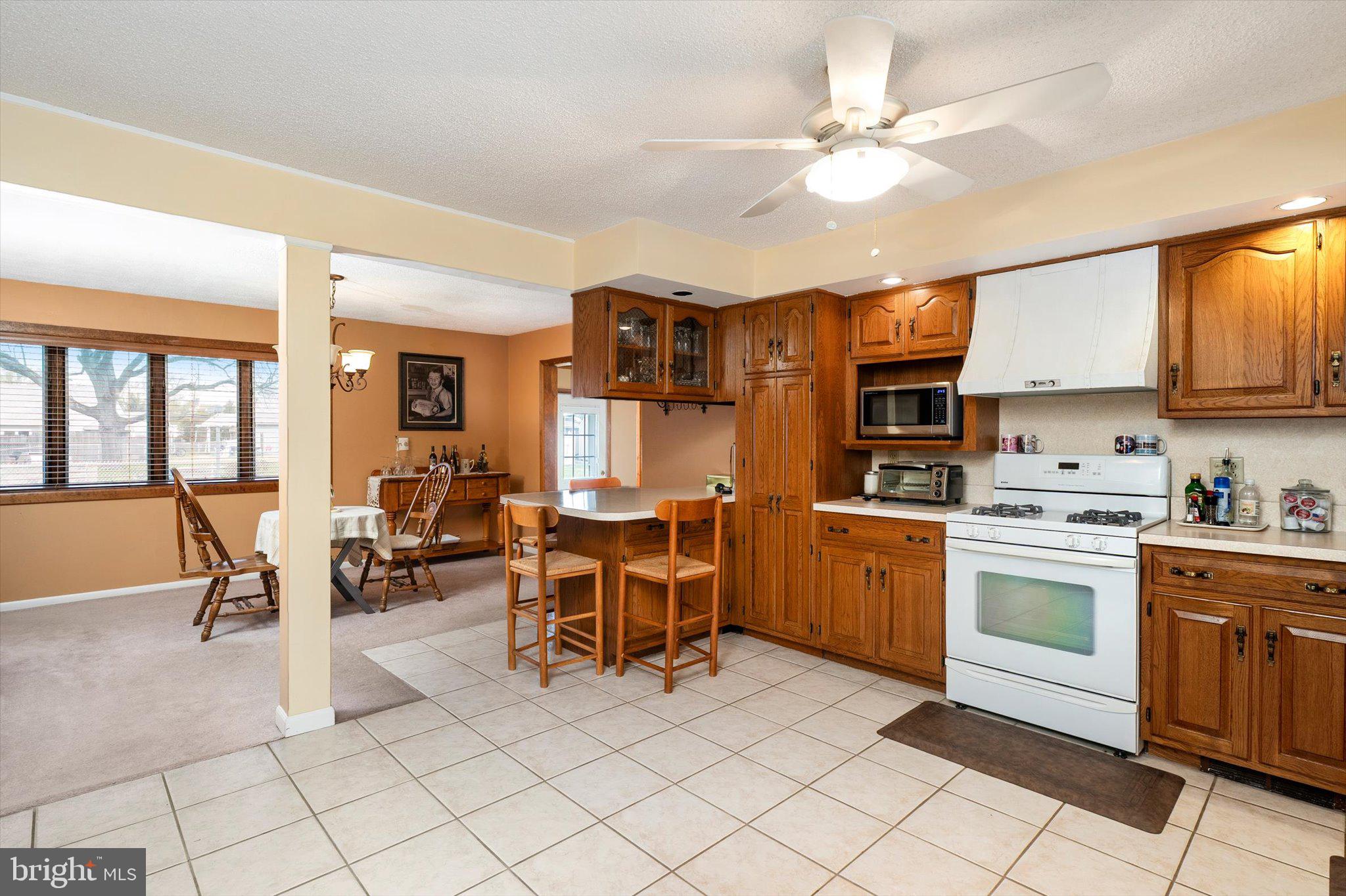 24 Cumberland Road Hamilton, NJ 08690 - Photo 4 of 29 a kitchen with cabinets and chairs