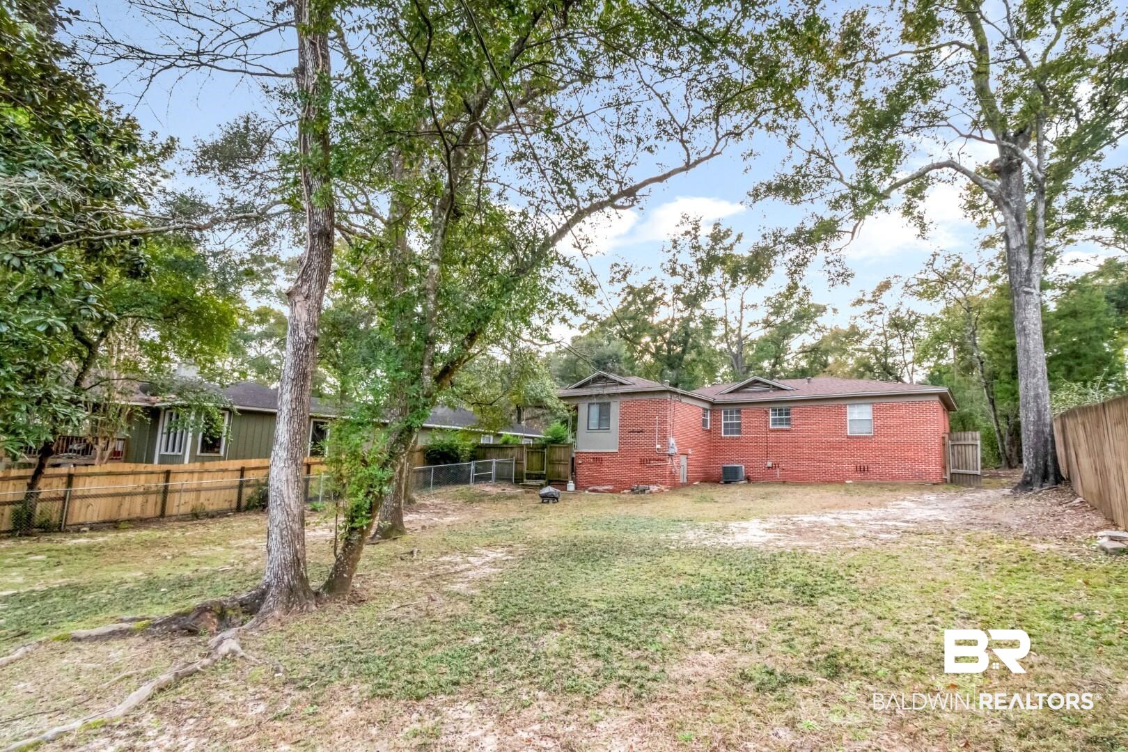 61 Nack Lane Mobile, AL 36608 - Photo 24 of 25 View of yard featuring central AC unit