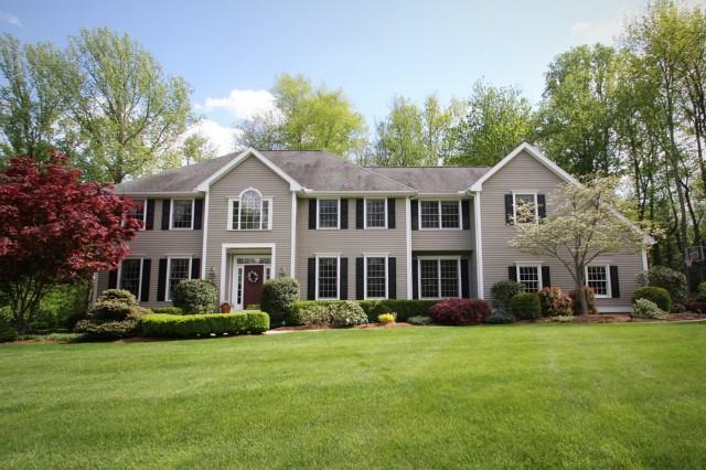 6 Blackhawk Road Trumbull, CT 06611 - Photo 1 of 1 a front view of a house with a garden