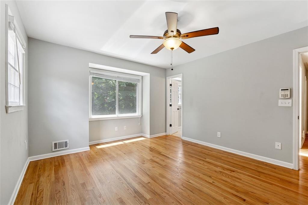 3675 Toxaway Court Chamblee, GA 30341 - Photo 18 of 37 a view of an empty room with wooden floor and a window