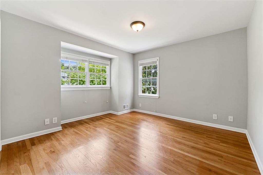 3675 Toxaway Court Chamblee, GA 30341 - Photo 21 of 37 a view of an empty room with wooden floor and a window