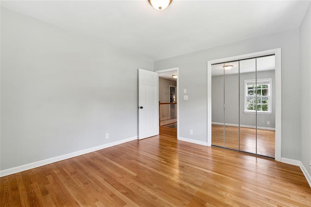 3675 Toxaway Court Chamblee, GA 30341 - Photo 23 of 37 an empty room with wooden floor and windows