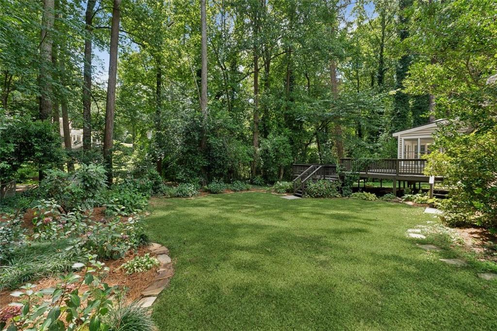3675 Toxaway Court Chamblee, GA 30341 - Photo 25 of 37 a backyard of a house with lots of green space
