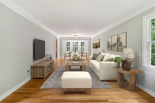 a living room with fireplace furniture and a flat screen tv
