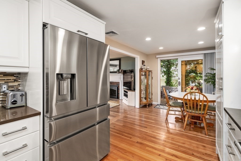1 Bow Street Wellesley, MA 02481 - Photo 13 of 37 a kitchen with stainless steel appliances a refrigerator and wooden floor
