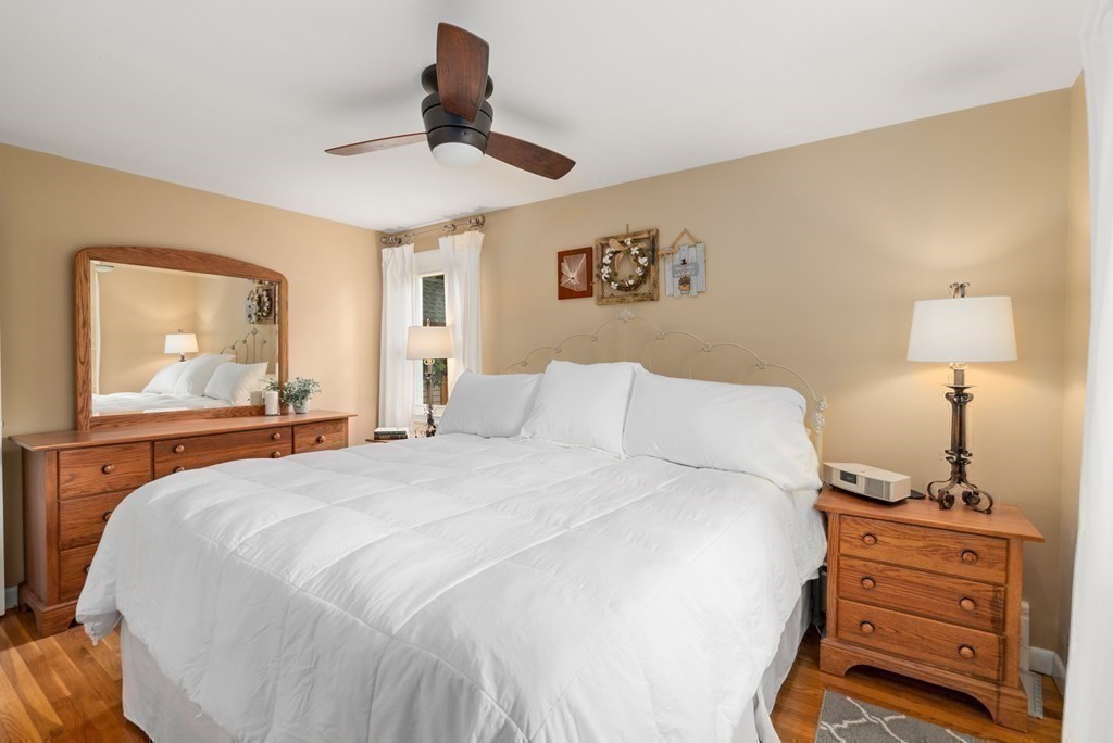 1 Bow Street Wellesley, MA 02481 - Photo 18 of 37 a bedroom with a bed and a dresser in it