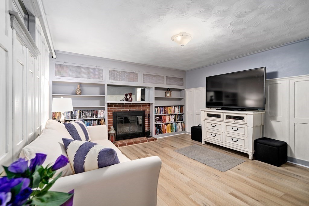 1 Bow Street Wellesley, MA 02481 - Photo 21 of 37 a living room with furniture and a flat screen tv
