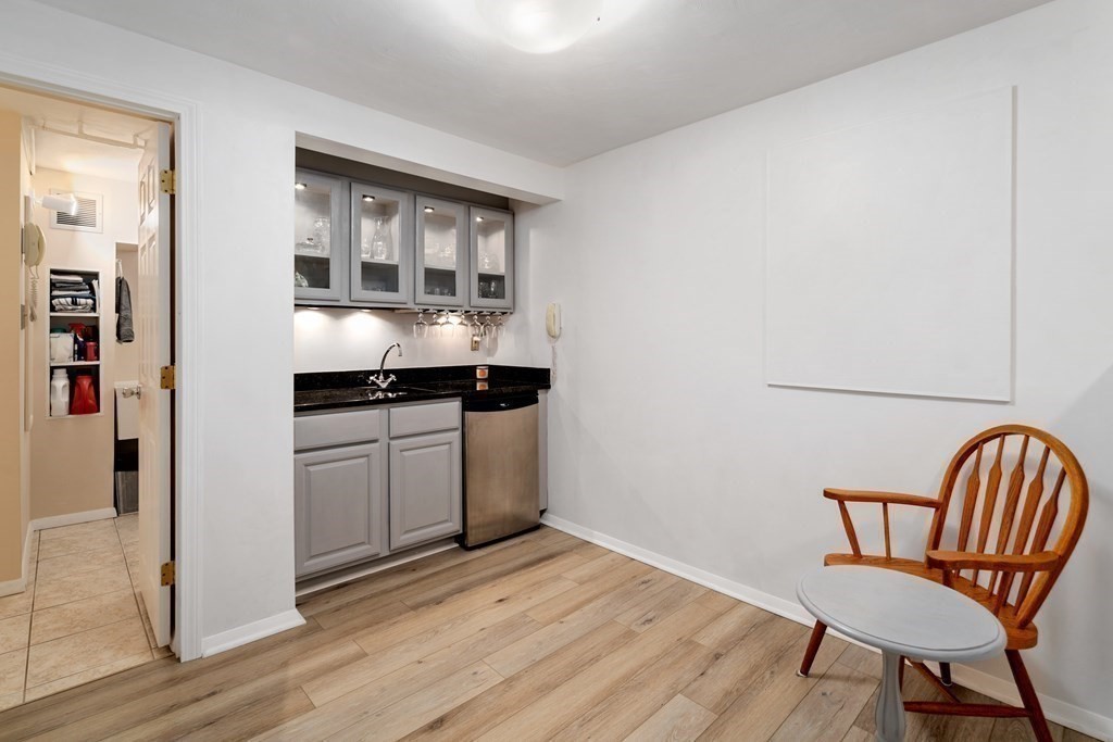1 Bow Street Wellesley, MA 02481 - Photo 27 of 37 a kitchen with a table and chairs