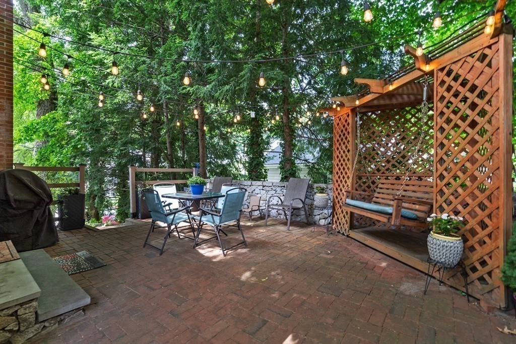 1 Bow Street Wellesley, MA 02481 - Photo 31 of 37 a view of backyard with a table and chairs