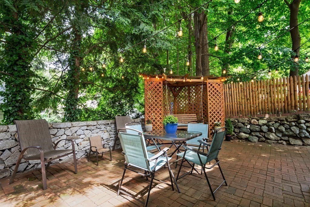 1 Bow Street Wellesley, MA 02481 - Photo 32 of 37 a view of a chairs and table in the patio