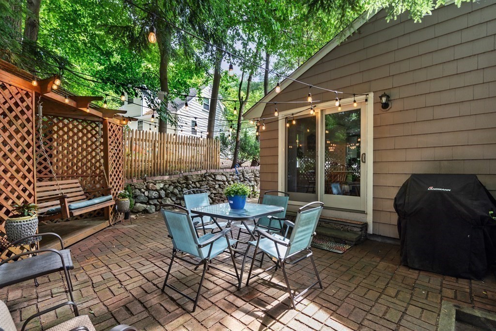 1 Bow Street Wellesley, MA 02481 - Photo 34 of 37 a view of a patio with table and chairs and potted plants