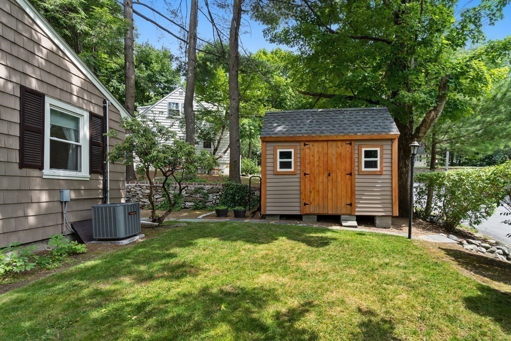 1 Bow Street Wellesley, MA 02481 - Photo 35 of 37 a view of a backyard with a large tree