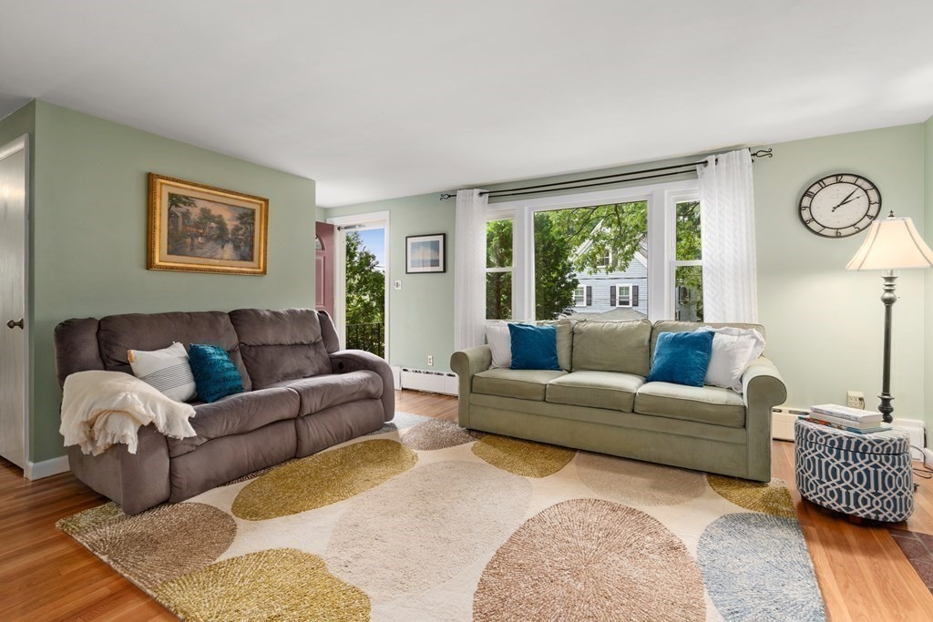 1 Bow Street Wellesley, MA 02481 - Photo 4 of 37 a living room with furniture and a large window