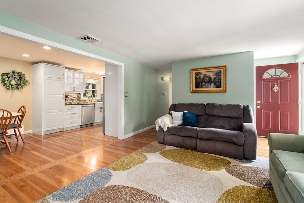 1 Bow Street Wellesley, MA 02481 - Photo 6 of 37 a living room with furniture and kitchen view
