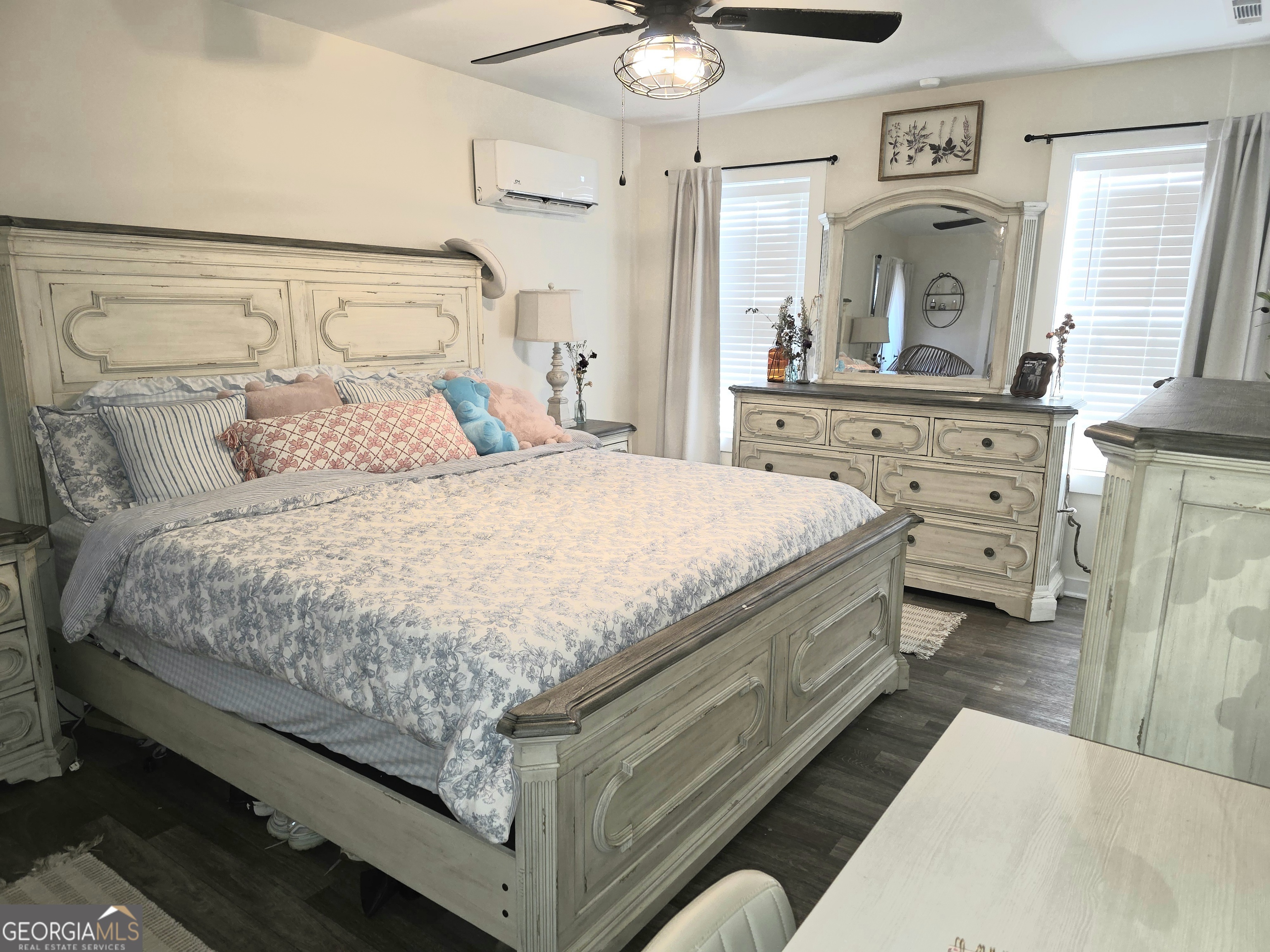 3060 Eatonton Road Madison, GA 30650 - Photo 47 of 65 a spacious bedroom with a bed and a dresser