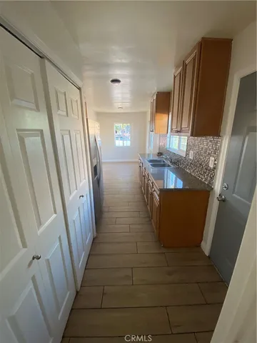 a view of living room and wooden floor
