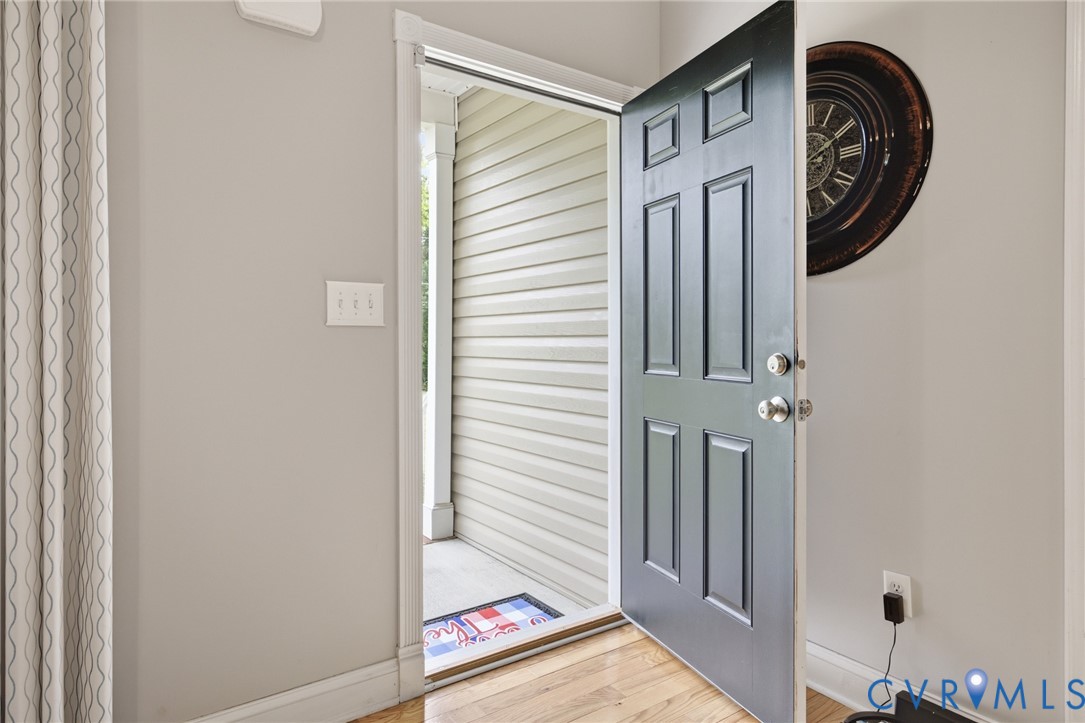 9433 Robin Road Disputanta, VA 23842 - Photo 3 of 26 Entryway featuring a paneled door with polished ha