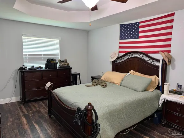 a bedroom with a bed and a table