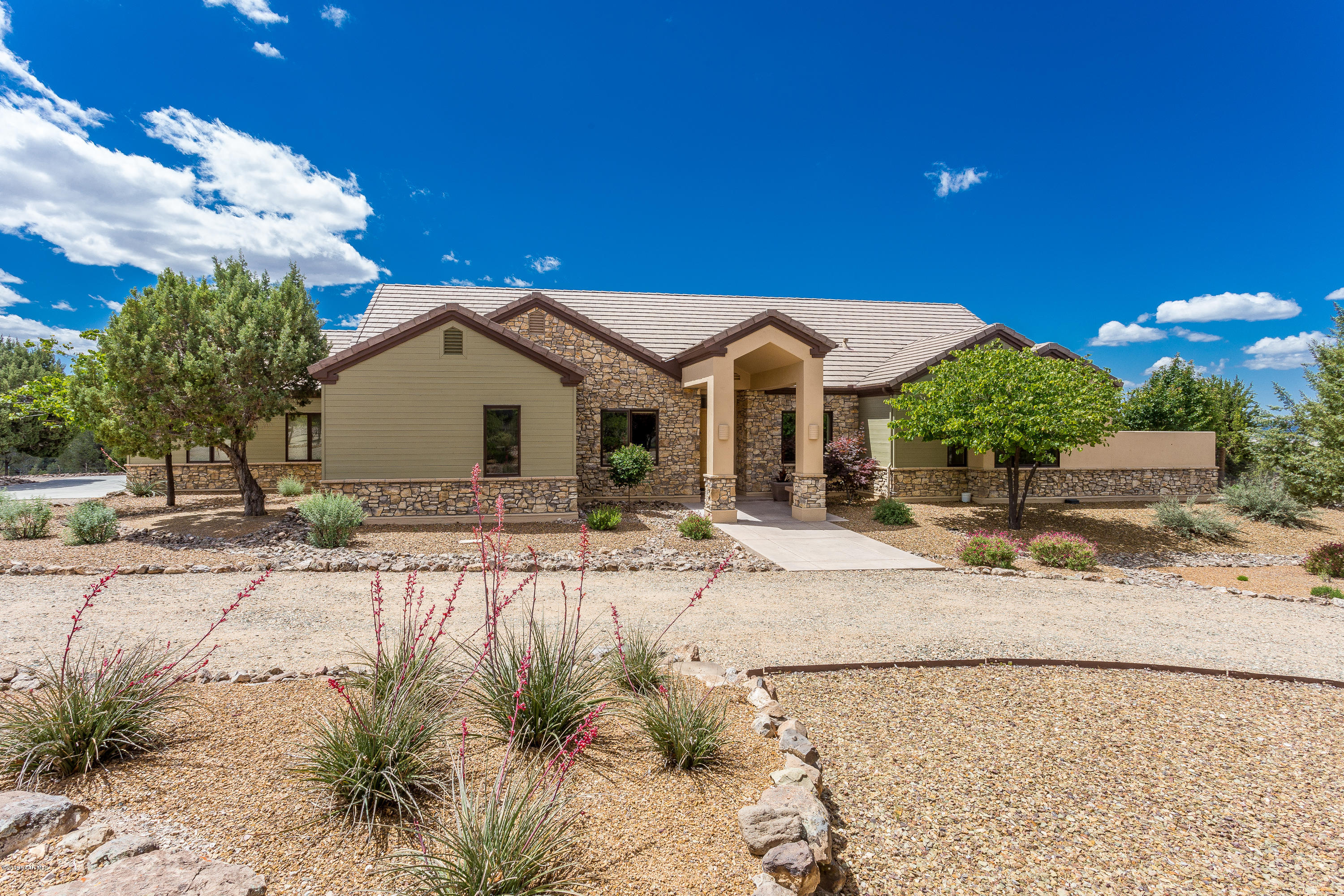 18401 Crossroads Ranch Road Prescott, AZ 86305 - Photo 1 of 51 a front view of a house with garden