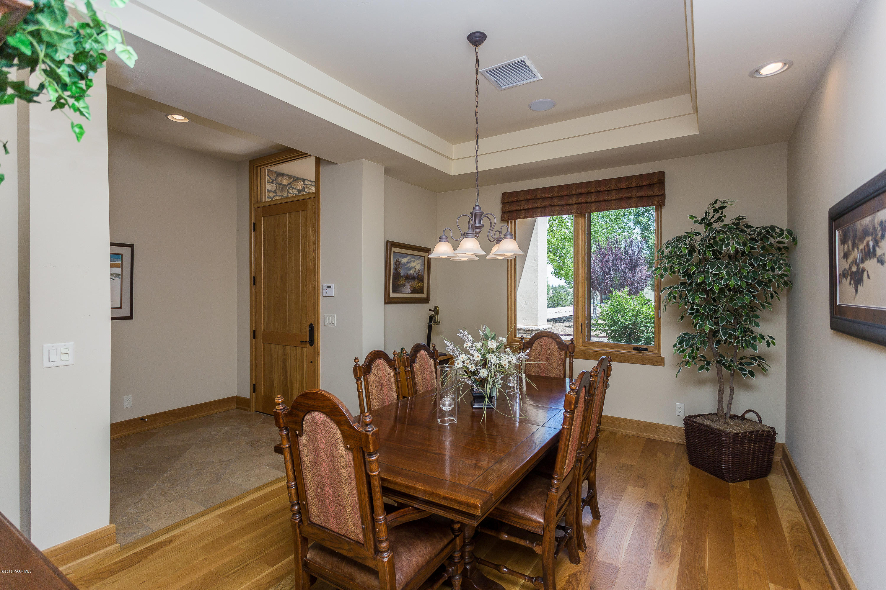 18401 Crossroads Ranch Road Prescott, AZ 86305 - Photo 13 of 51 a view of a dining room with furniture window and wooden floor