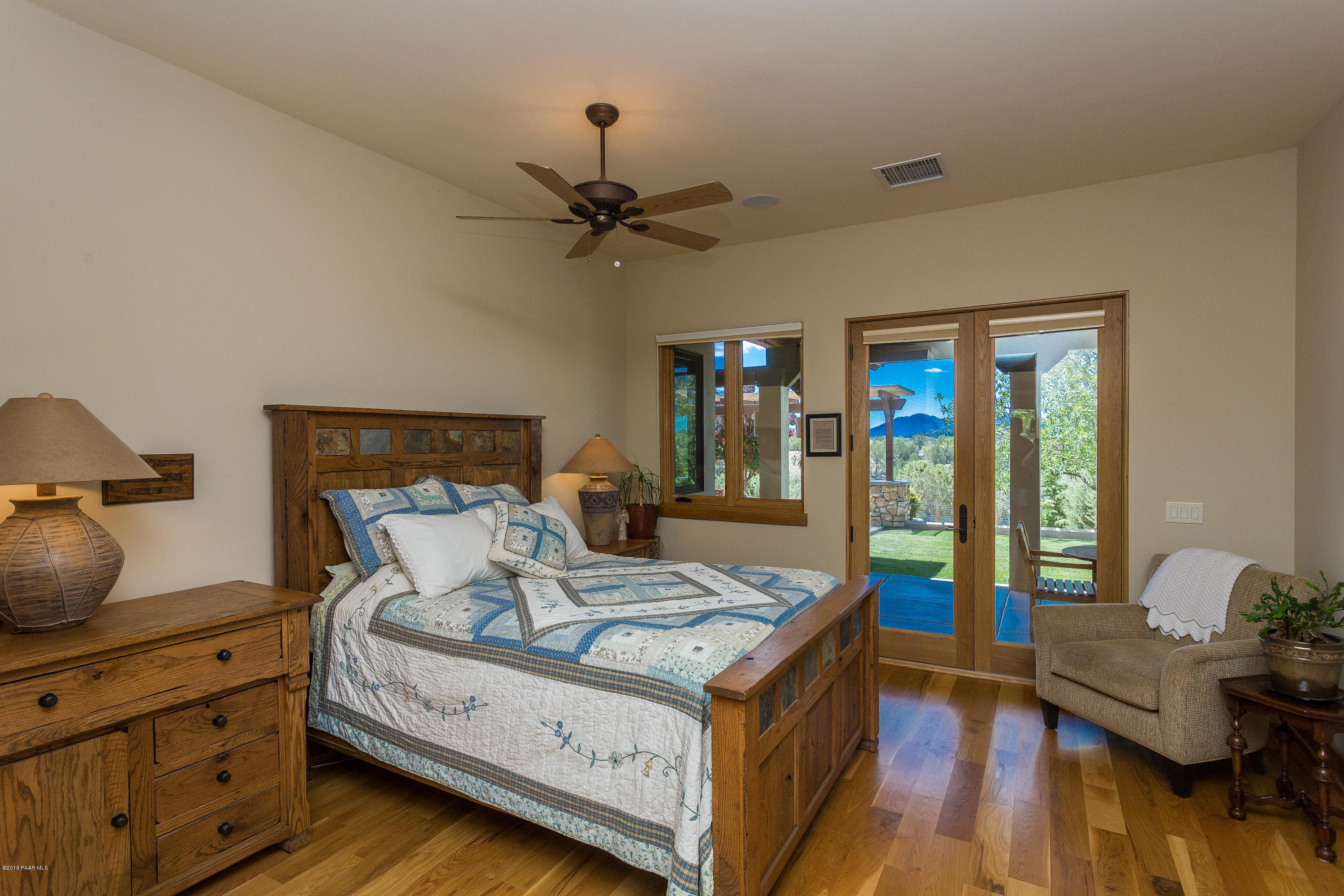 18401 Crossroads Ranch Road Prescott, AZ 86305 - Photo 15 of 51 a bedroom with a bed and wooden floor