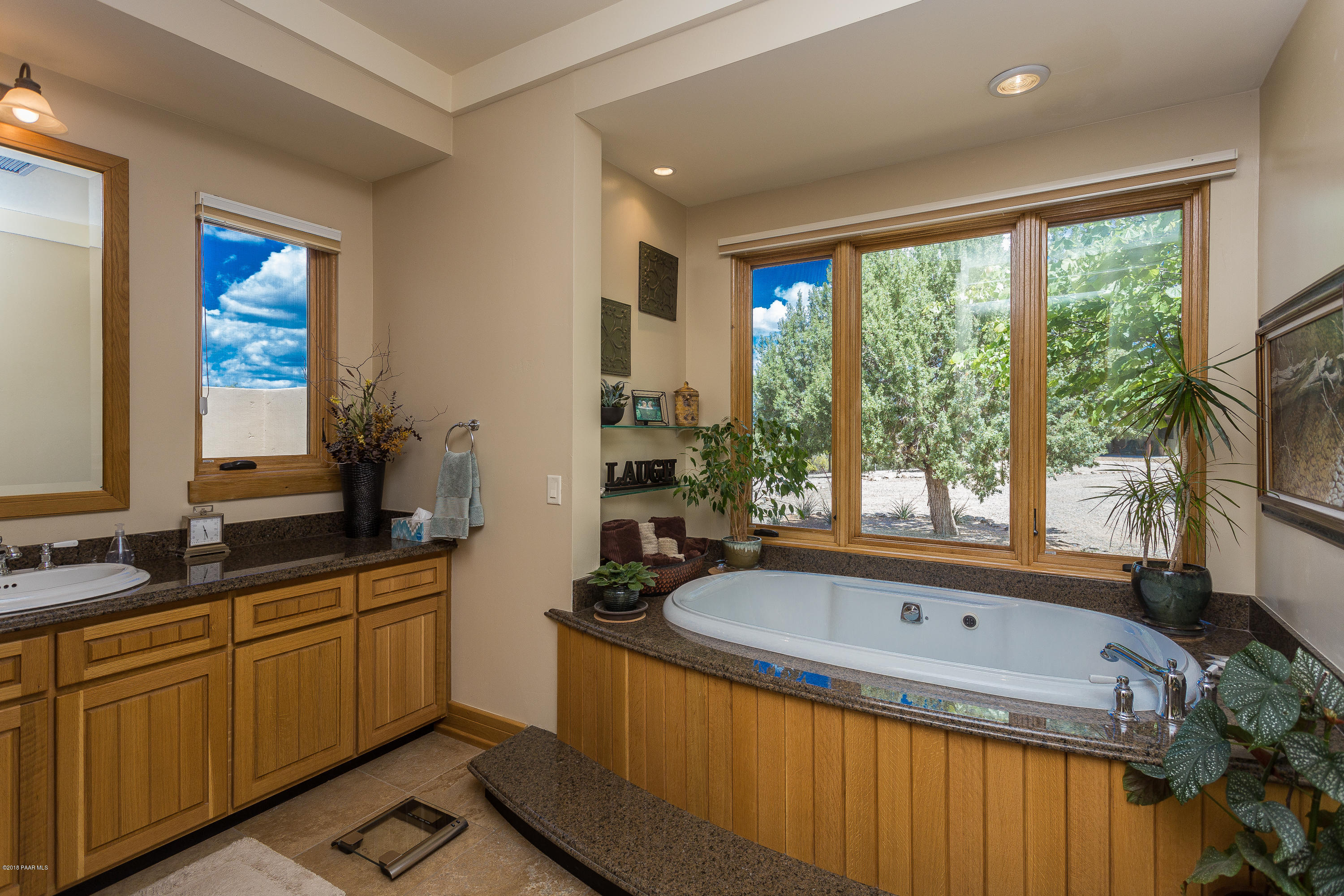 18401 Crossroads Ranch Road Prescott, AZ 86305 - Photo 18 of 51 a bathroom with a bathtub and a sink