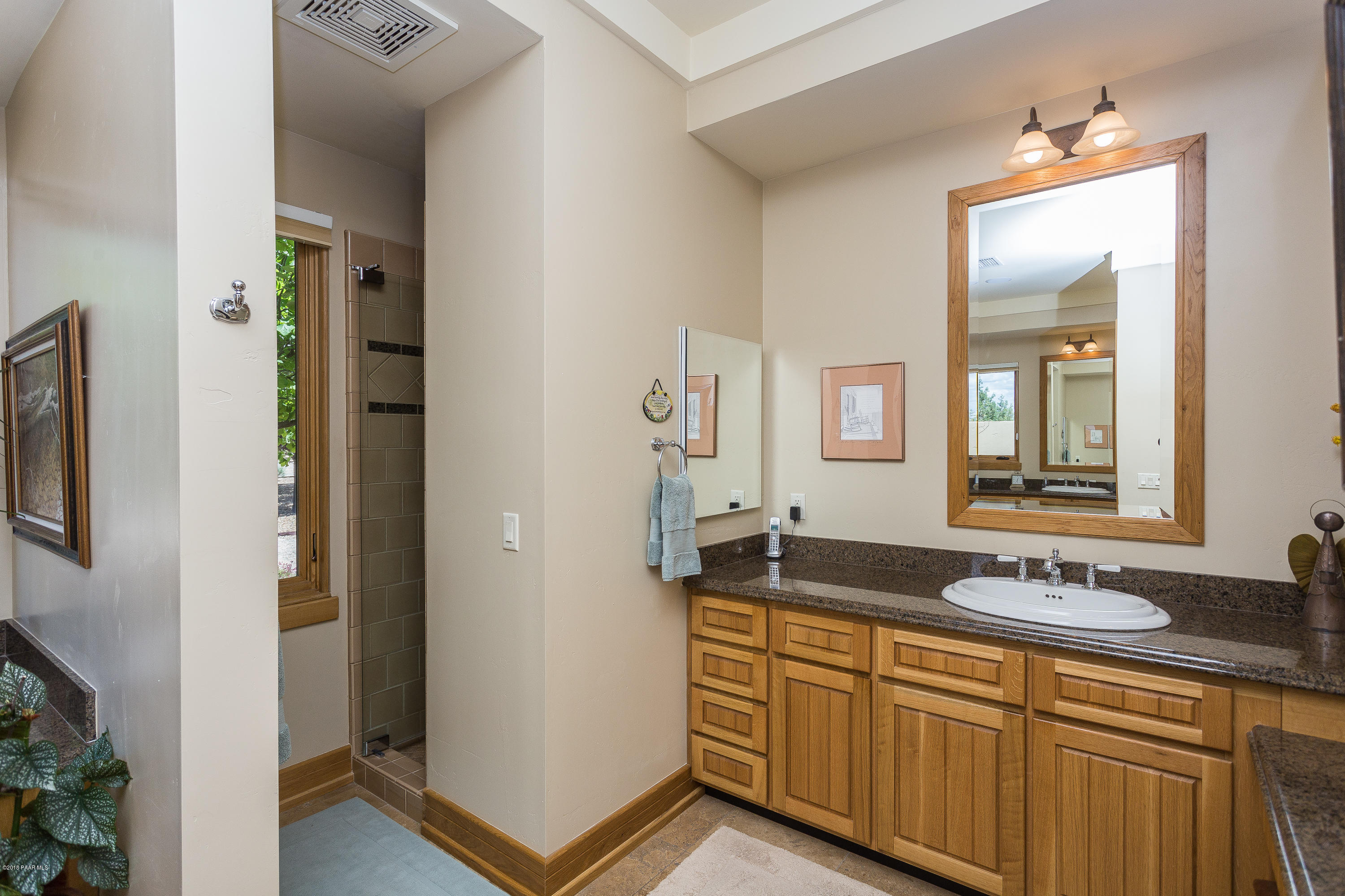 18401 Crossroads Ranch Road Prescott, AZ 86305 - Photo 20 of 51 a bathroom with a sink and a mirror
