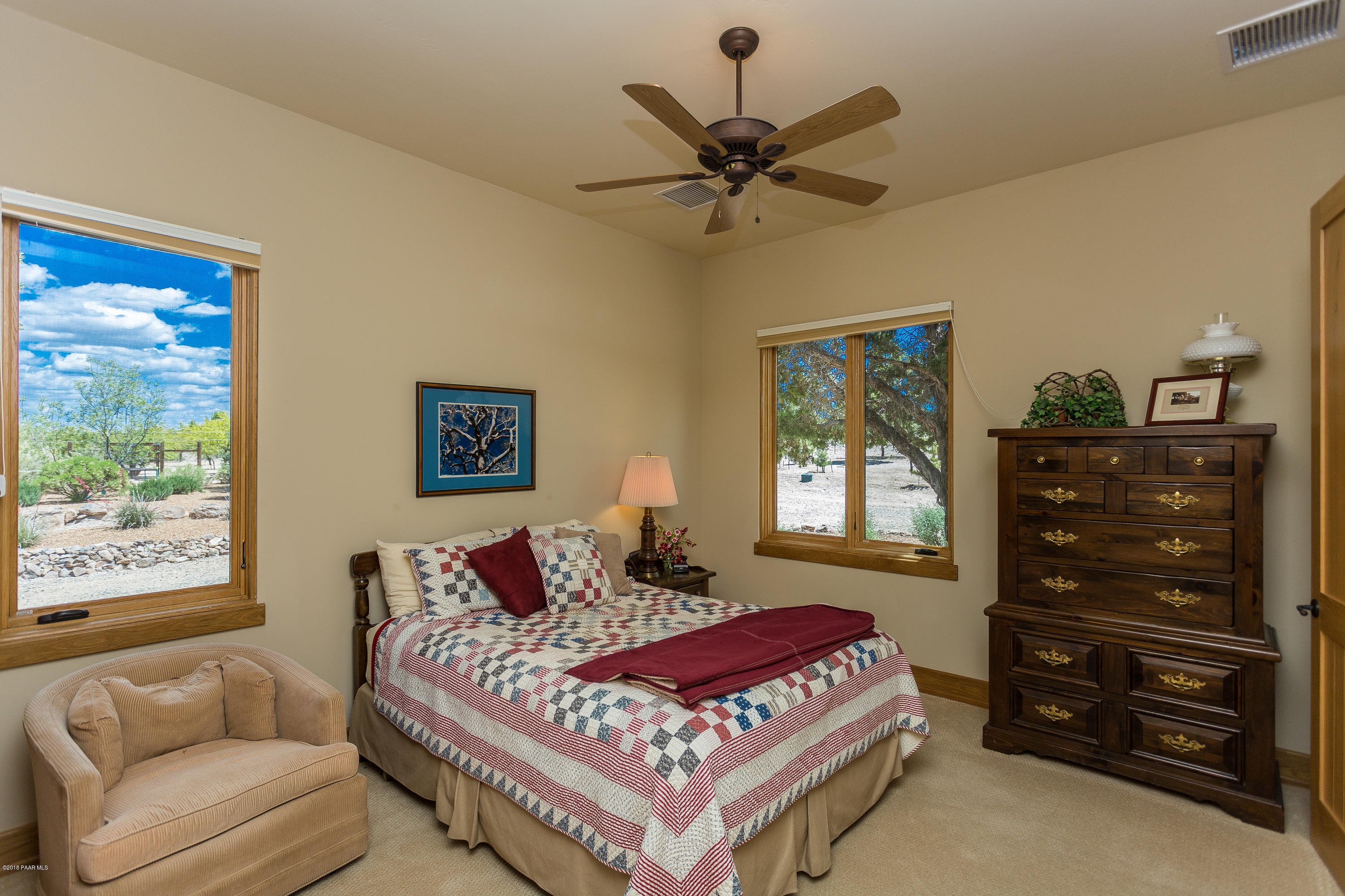 18401 Crossroads Ranch Road Prescott, AZ 86305 - Photo 22 of 51 a bedroom with a bed and a window