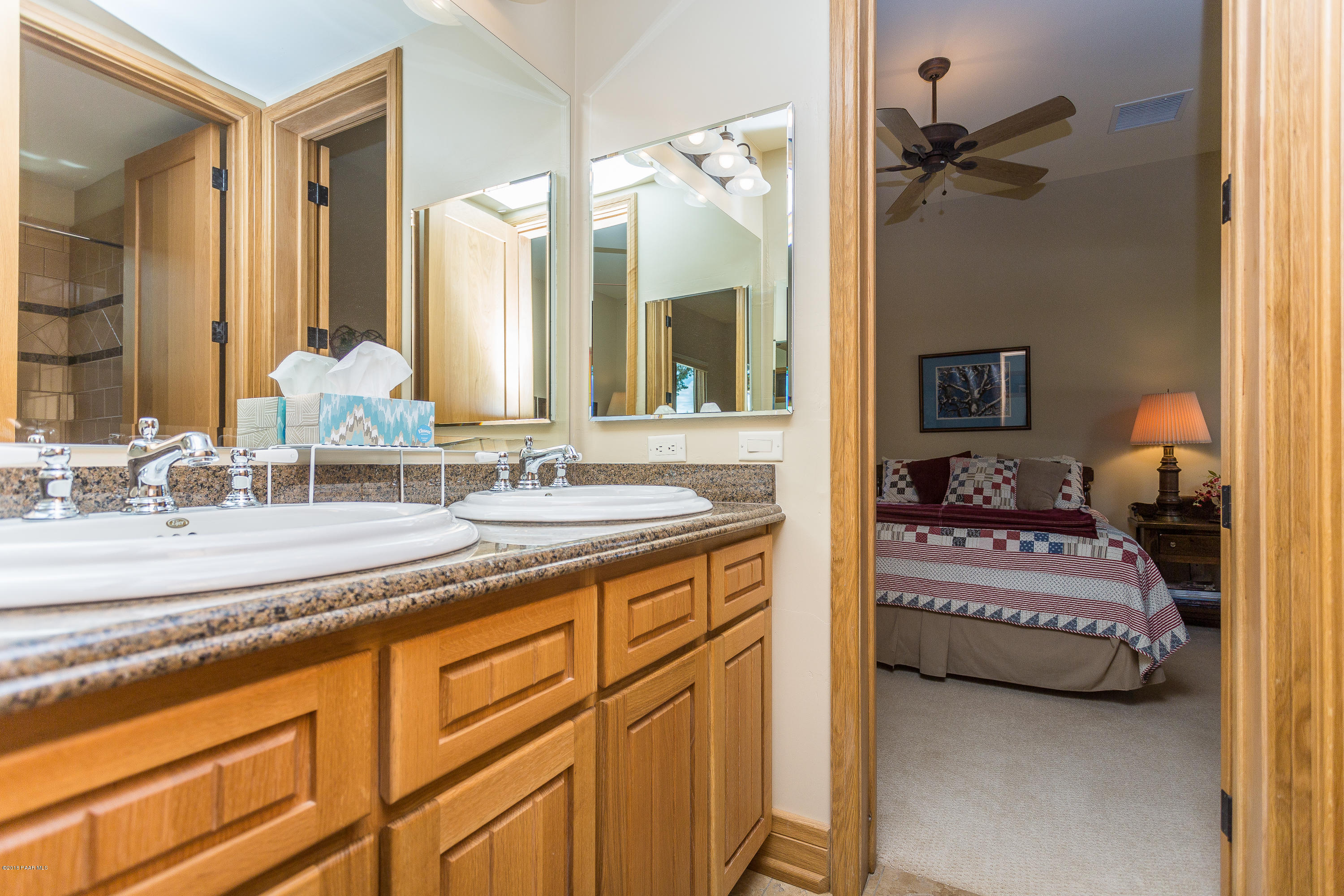 18401 Crossroads Ranch Road Prescott, AZ 86305 - Photo 23 of 51 a en suite bathroom with a double vanity sink and a mirror