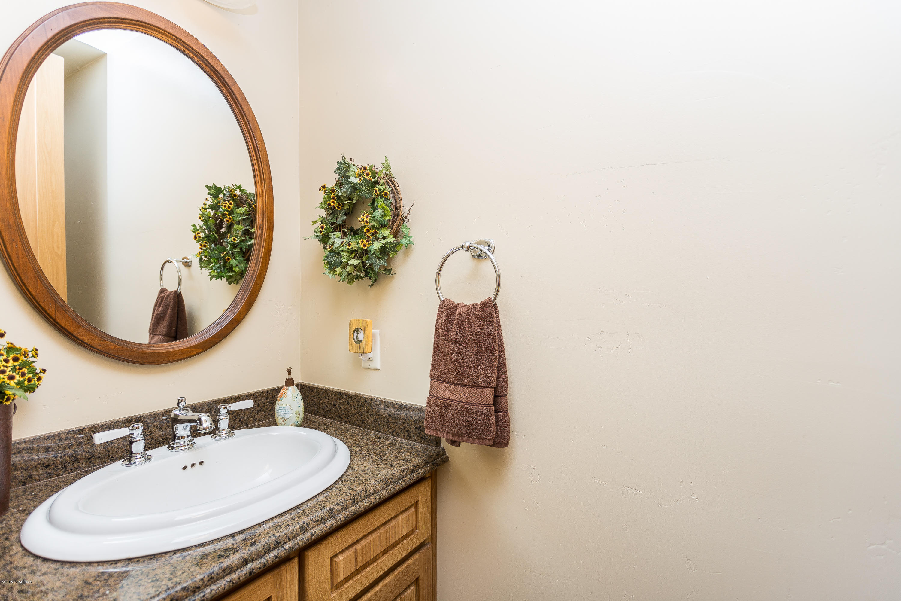 18401 Crossroads Ranch Road Prescott, AZ 86305 - Photo 27 of 51 a bathroom with a sink and a mirror
