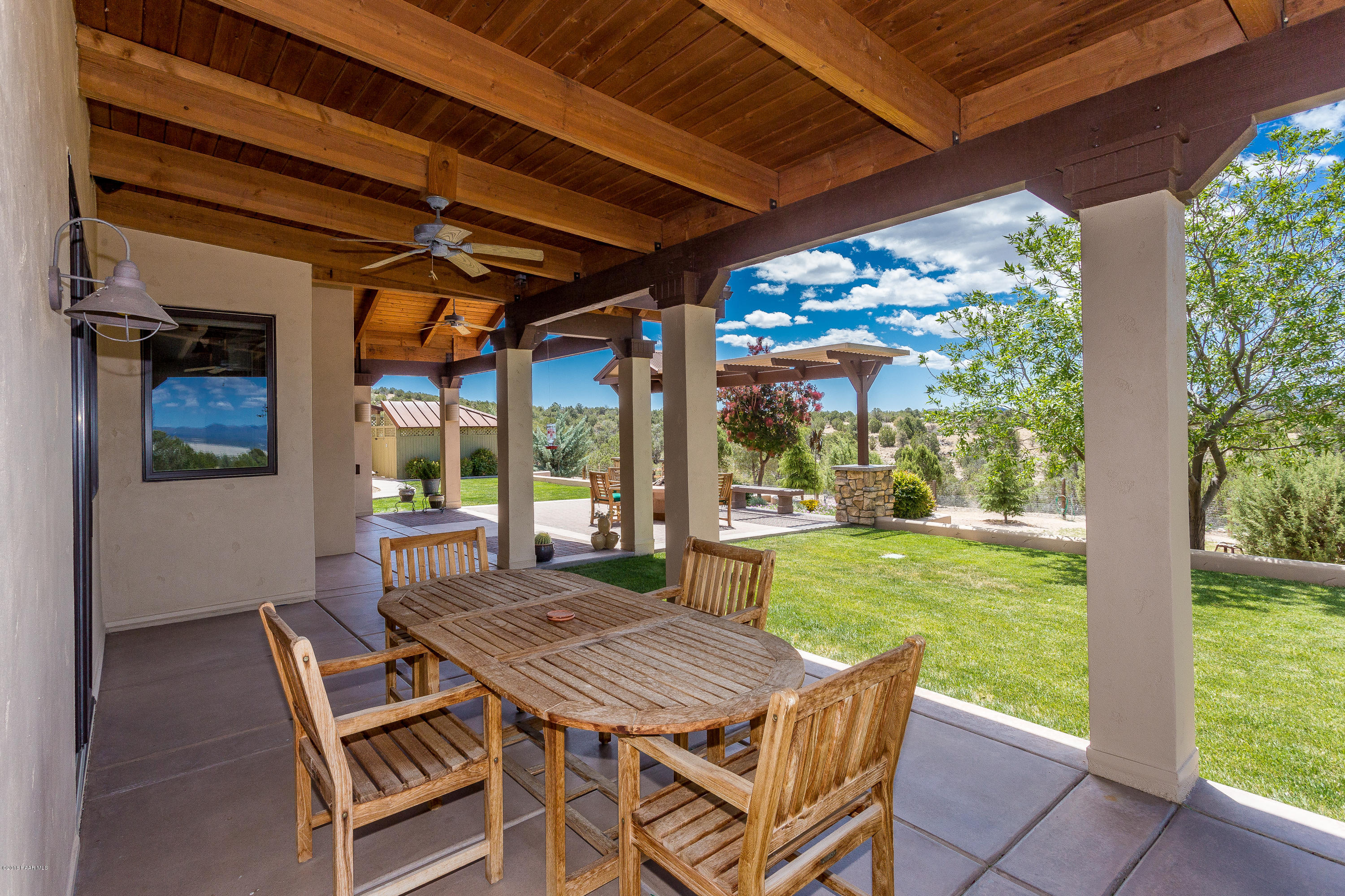 18401 Crossroads Ranch Road Prescott, AZ 86305 - Photo 29 of 51 a view of an outdoor dining space with a table and chairs