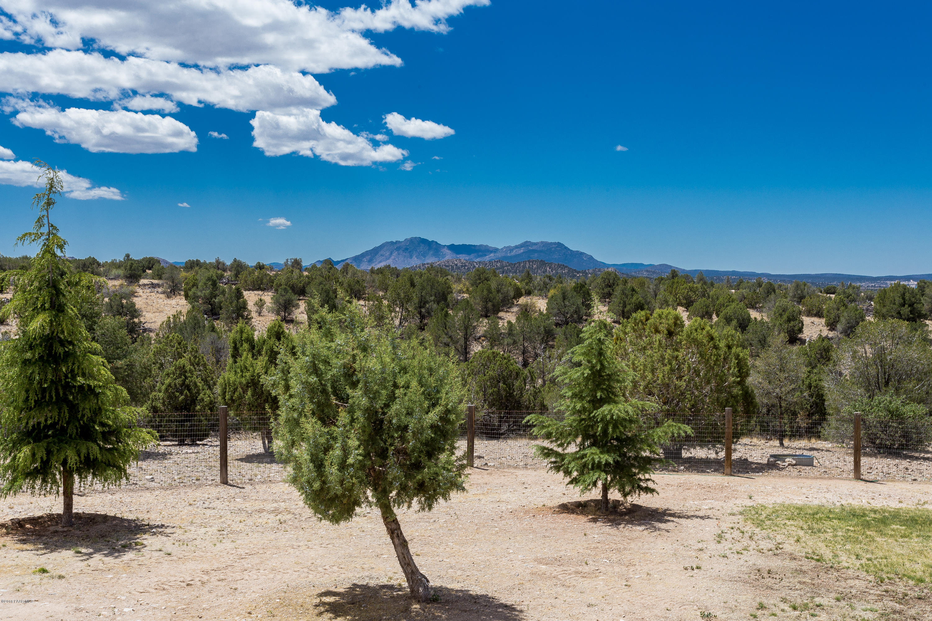 18401 Crossroads Ranch Road Prescott, AZ 86305 - Photo 33 of 51 a view of a backyard of a house with a mountain
