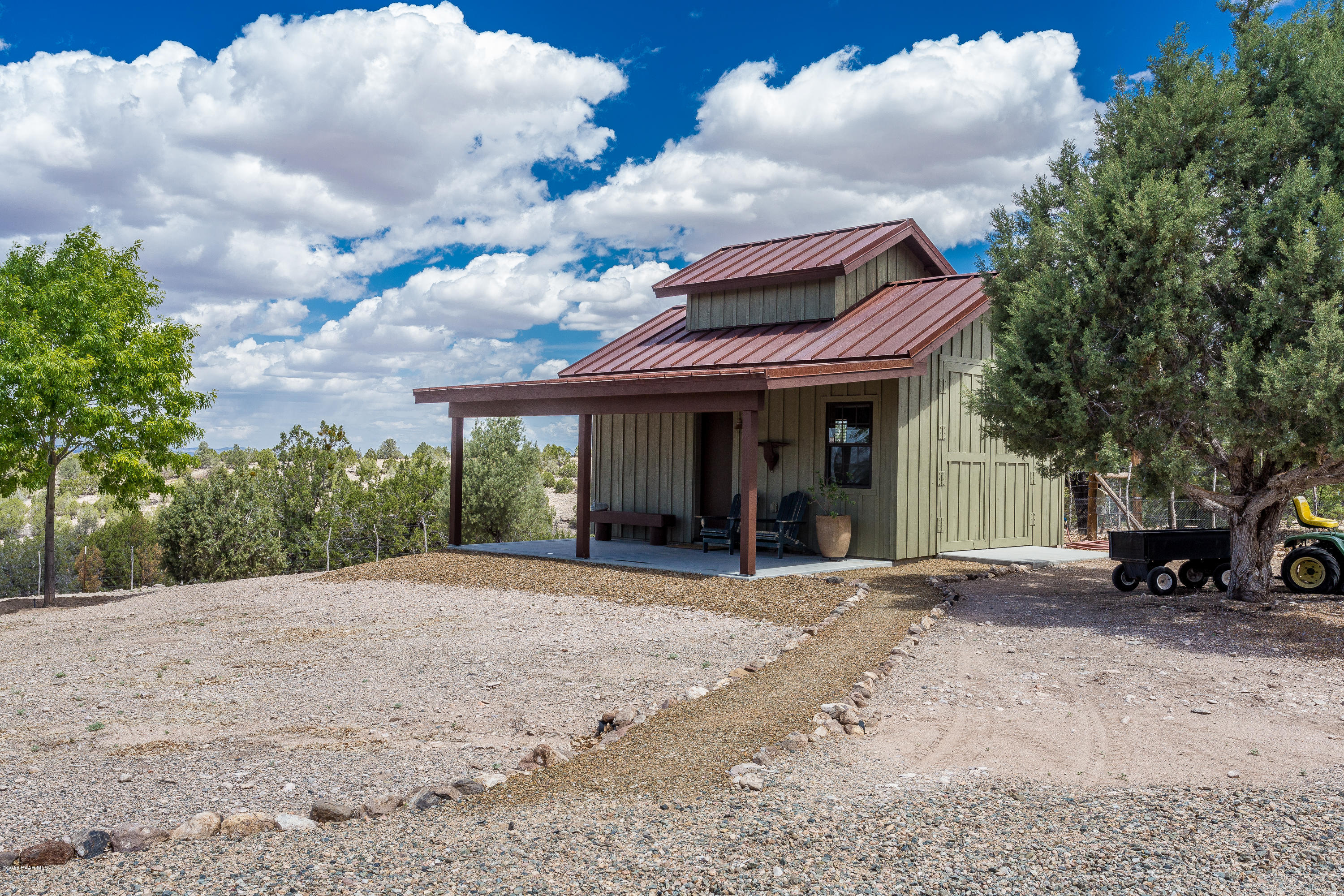 18401 Crossroads Ranch Road Prescott, AZ 86305 - Photo 43 of 51 a view of a house with a patio