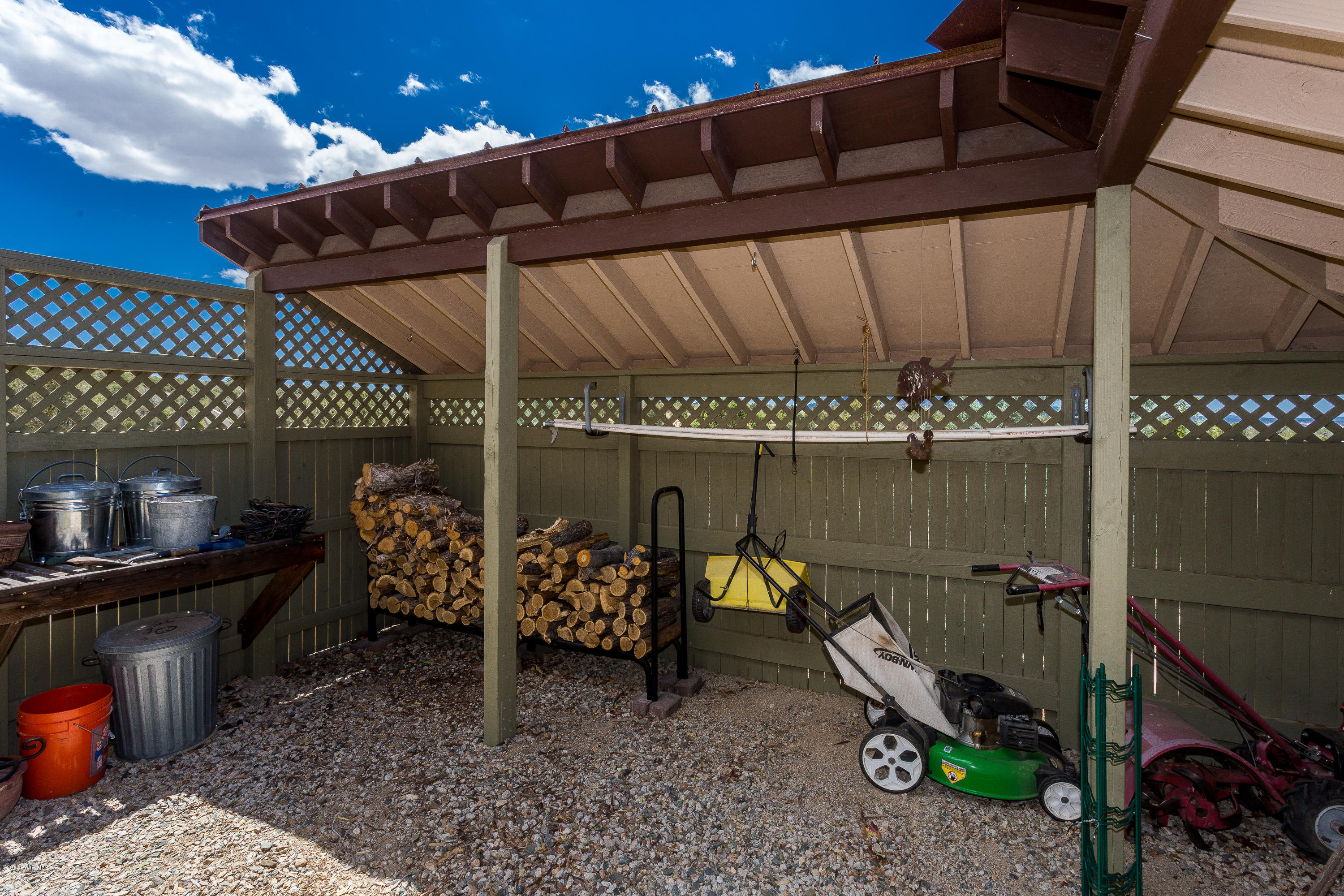 18401 Crossroads Ranch Road Prescott, AZ 86305 - Photo 50 of 51 a view of a chairs and table in the patio