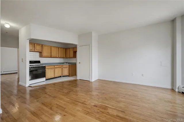 a view of kitchen with a sink and a stove top oven