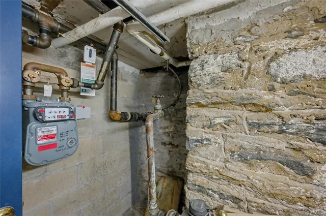 a utility room with dryer and shower