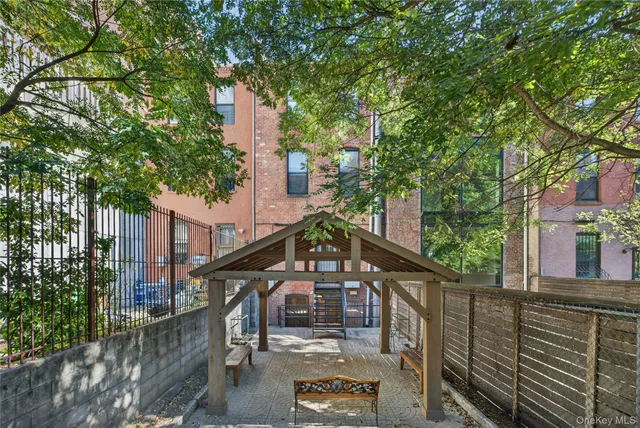 a front view of a house with large windows