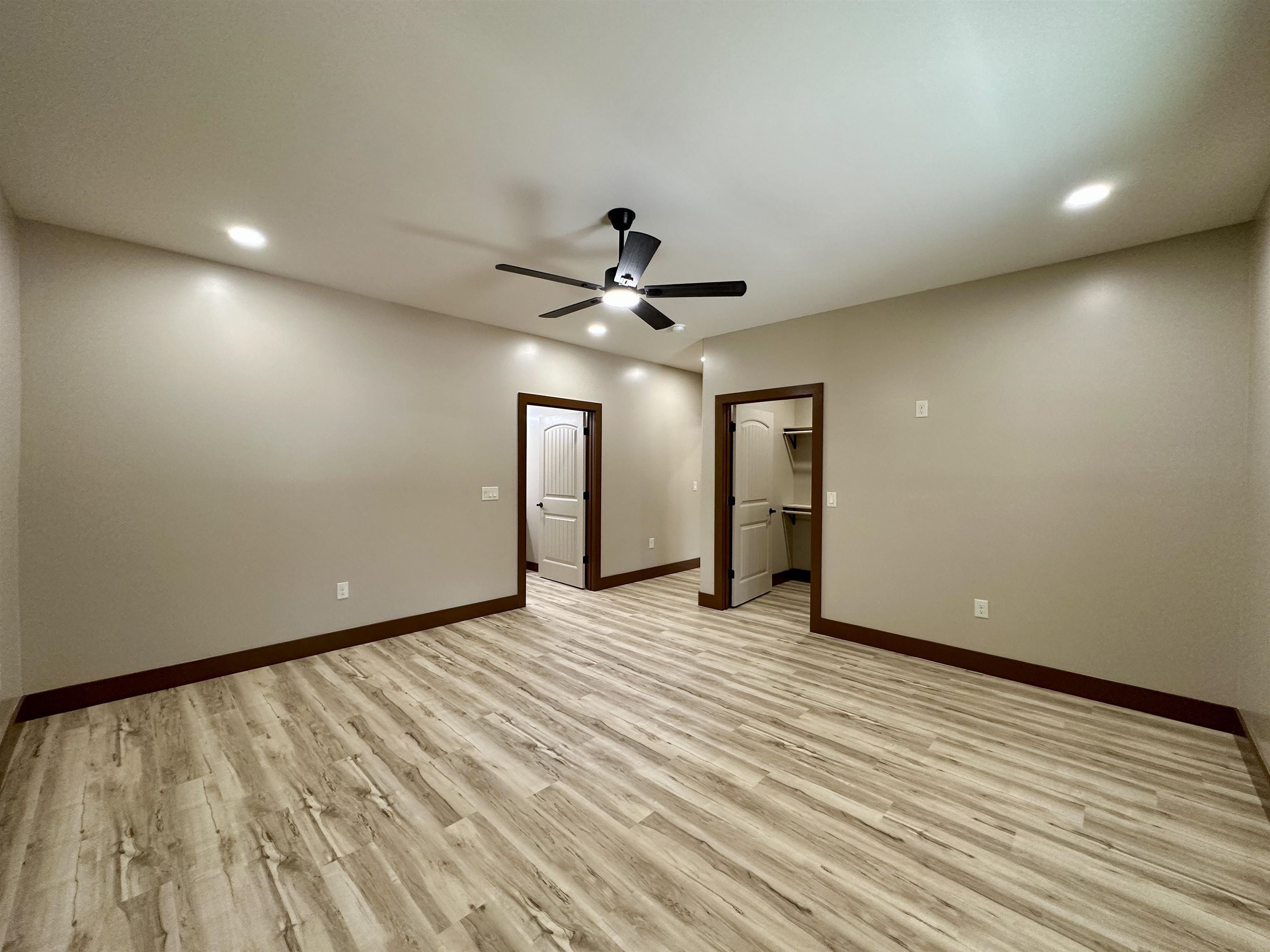 1137 Arl Bailey Road Finger, TN 38334 - Photo 11 of 40 a view of an empty room with wooden floor and a ceiling fan