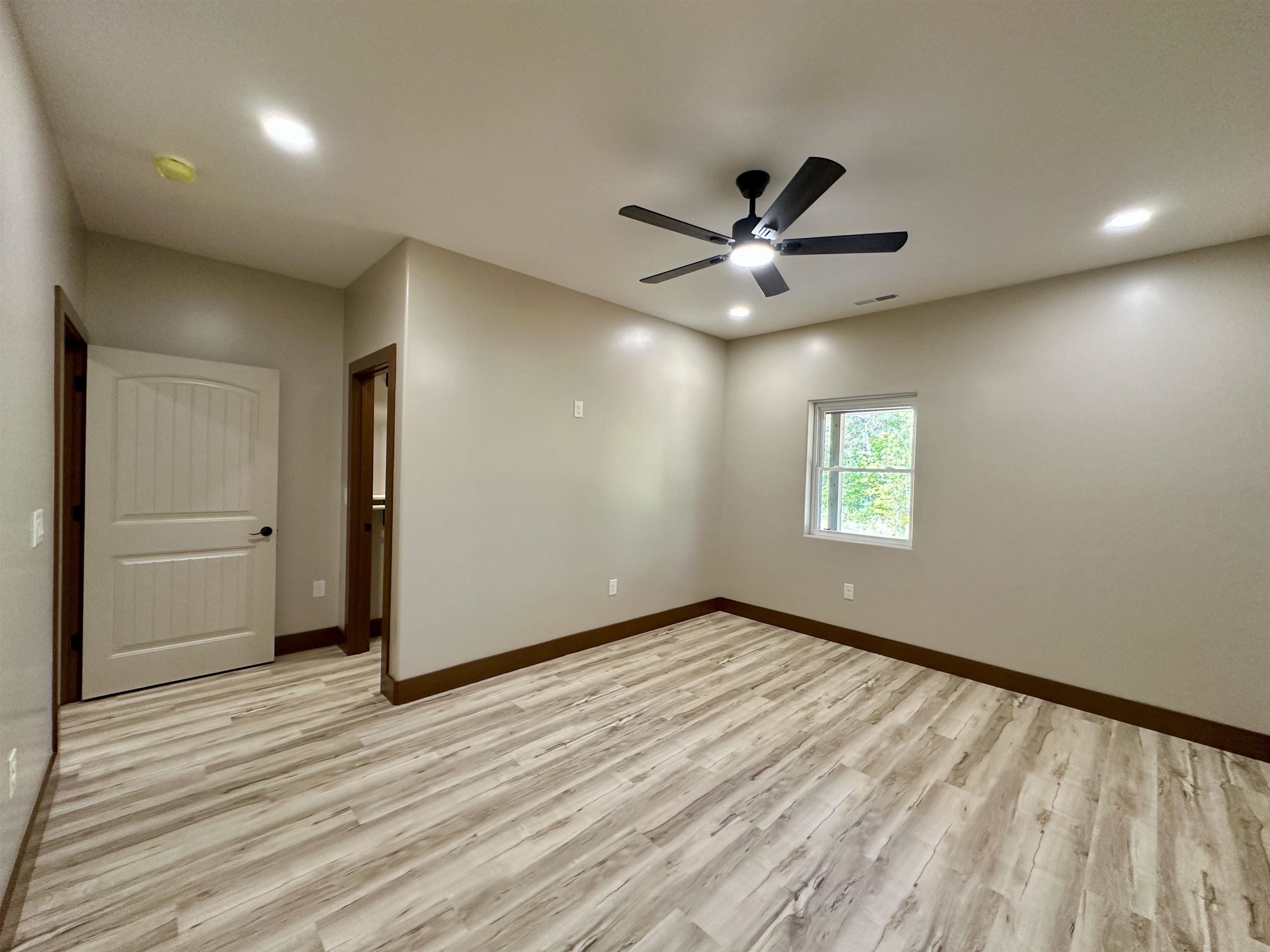 1137 Arl Bailey Road Finger, TN 38334 - Photo 19 of 40 wooden floor in an empty room with a window