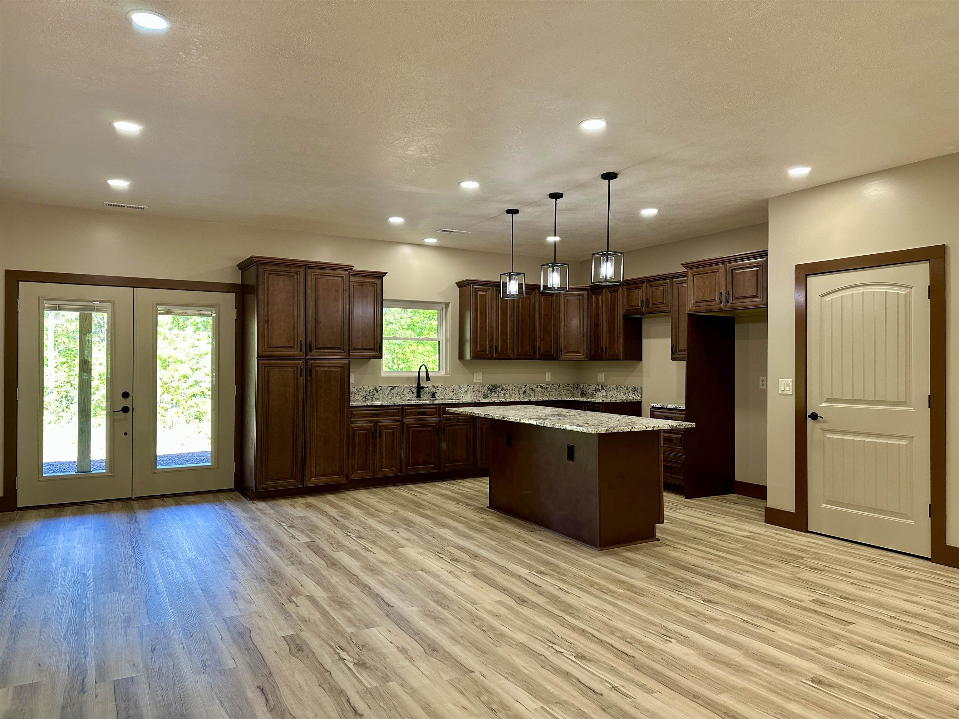 1137 Arl Bailey Road Finger, TN 38334 - Photo 4 of 40 a large kitchen with lots of counter space and stainless steel appliances