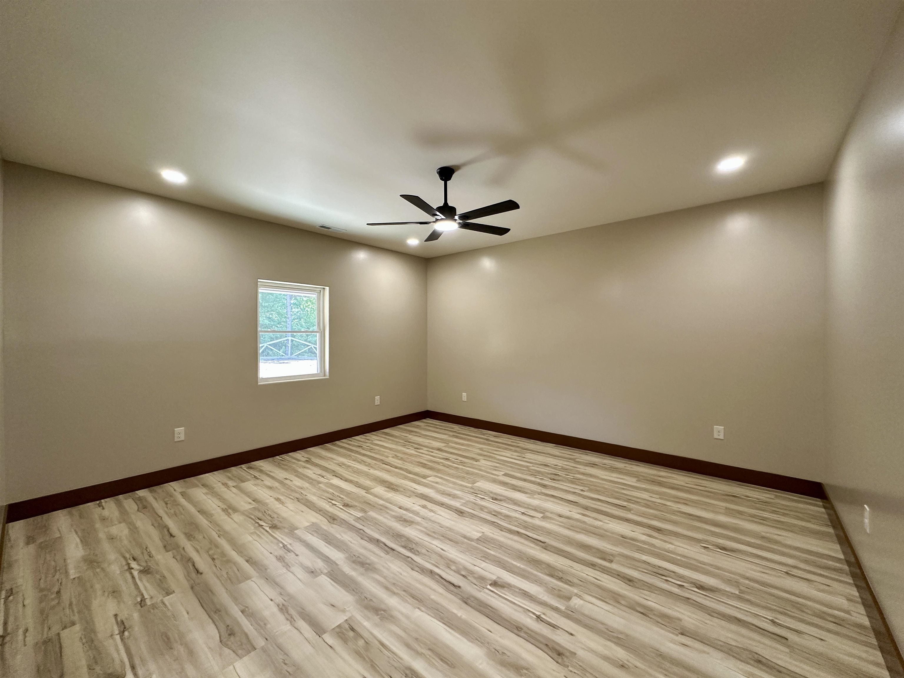 1137 Arl Bailey Road Finger, TN 38334 - Photo 10 of 40 wooden floor in an empty room with a window