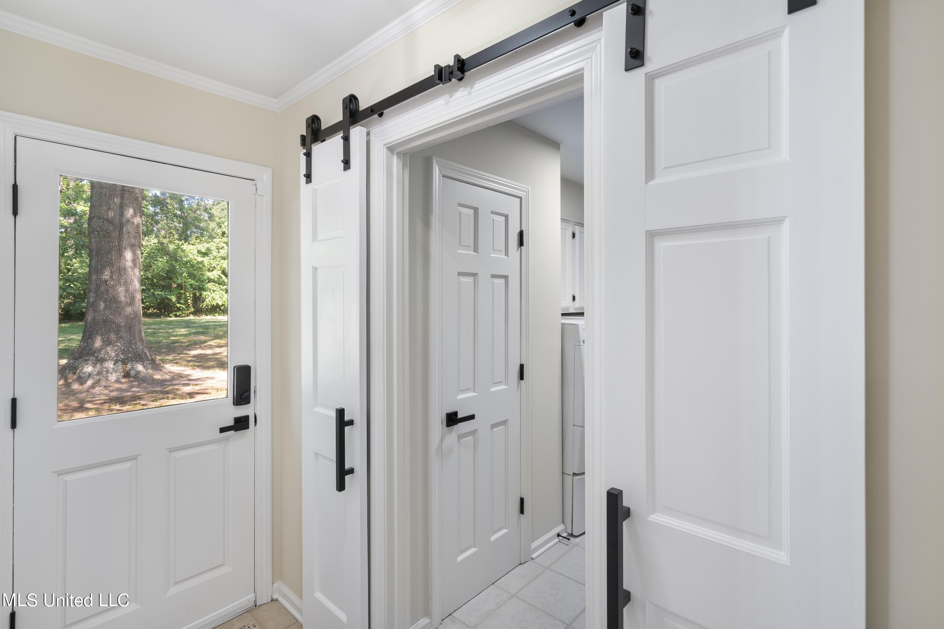 1935 Mt Pleasant Road Hernando, MS 38632 - Photo 26 of 50 Laundry hallway with exterior door!