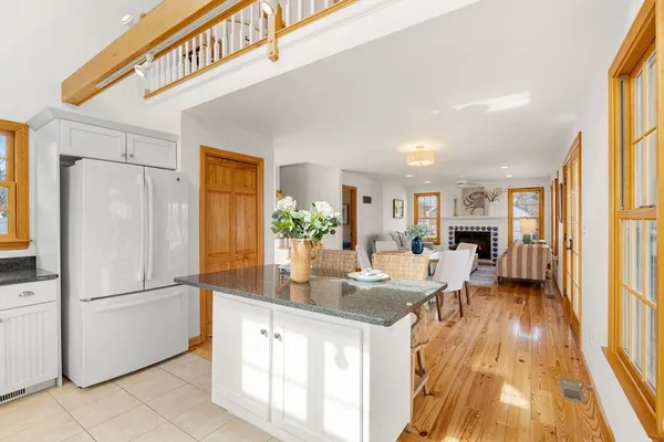 a kitchen with stainless steel appliances granite countertop a refrigerator and a sink