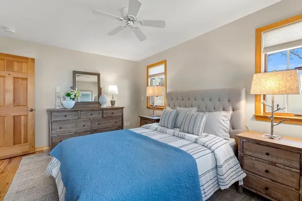 a bedroom with a bed and a dresser