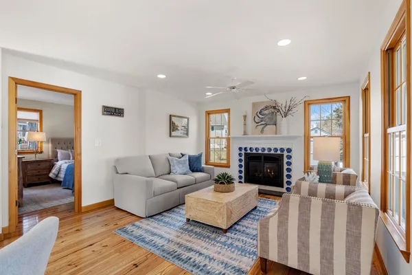 a living room with furniture and a fireplace