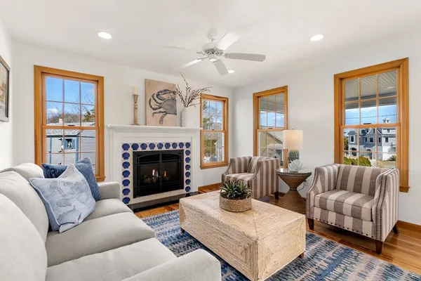 a living room with furniture and a fireplace