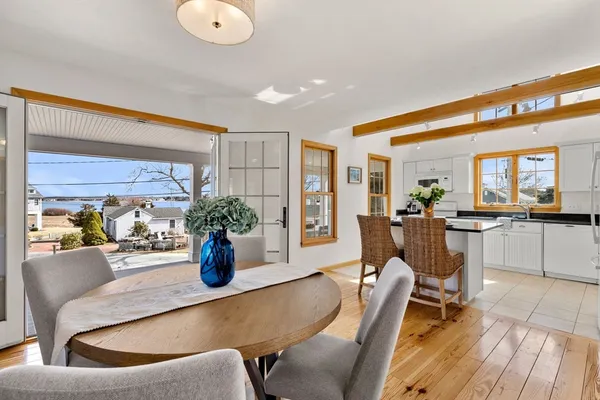 a dining room with furniture and window