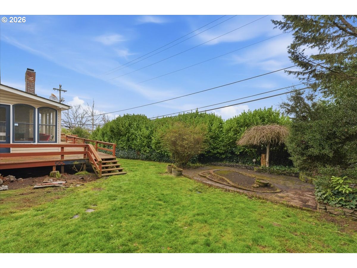706 West B Street Rainier, OR 97048 - Photo 32 of 47 a backyard of a house with seating space