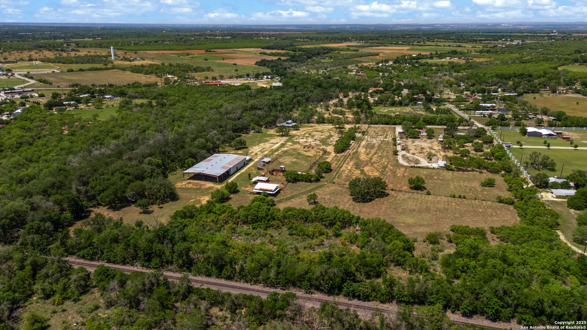 11224 Atkins Road Atascosa, TX 78002 - Photo 13 of 45 an aerial view of residential building with outdoor space