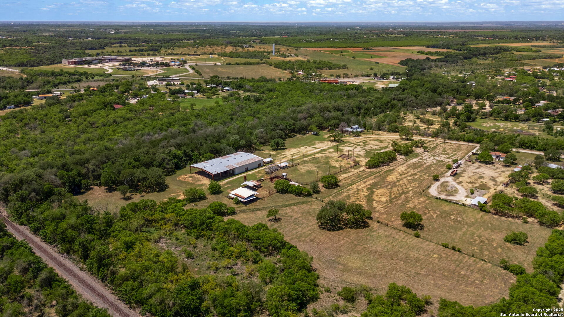 11224 Atkins Road Atascosa, TX 78002 - Photo 14 of 45 an aerial view of residential houses with outdoor space